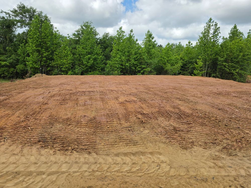 Our build pads service ensures a stable foundation for your outdoor projects, using expert techniques to prevent tree root disruption while supporting your landscaping and construction needs efficiently and safely. for Page Outdoor Services in Wrightsville, GA