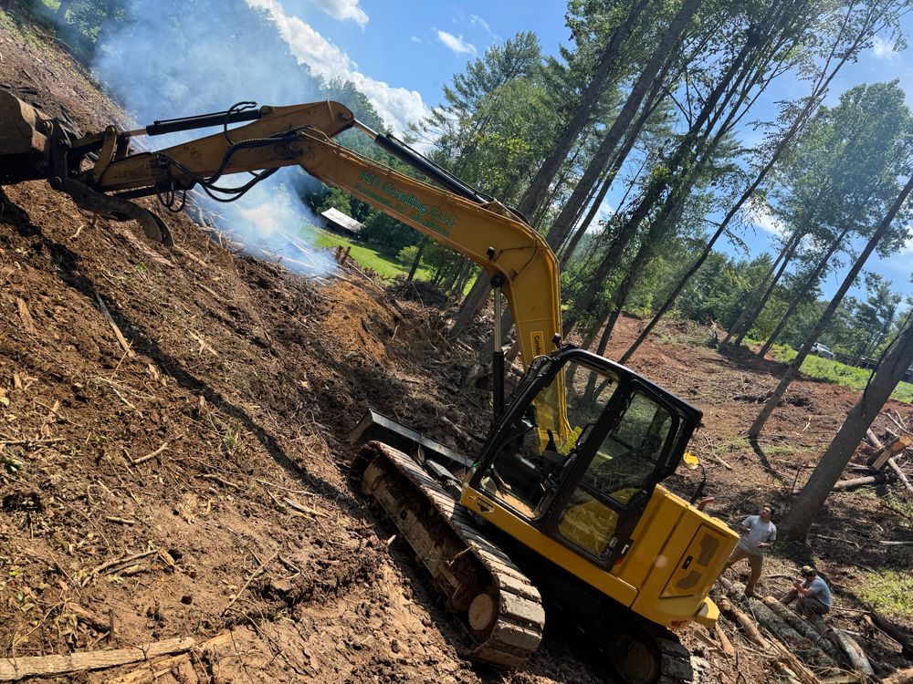 Our land clearing service efficiently removes unwanted vegetation, trees, and debris to transform your property into a clean slate, perfect for new landscaping projects or enhancing your home's curb appeal. for HD Grading in Swannanoa, NC