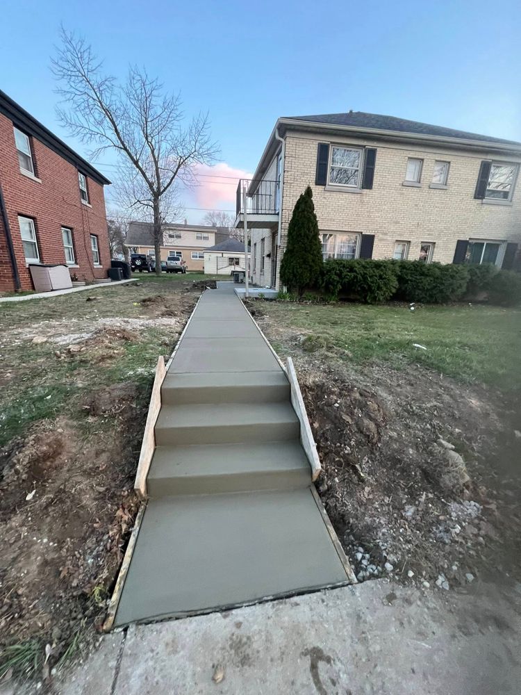 Our Sidewalk Installation service offers homeowners durable, expertly crafted walkways that enhance curb appeal and ensure safety. Trust our skilled team to provide reliable, professional results tailored to your property’s needs. for MKE Concrete Contractors LLC in Milwaukee, WI