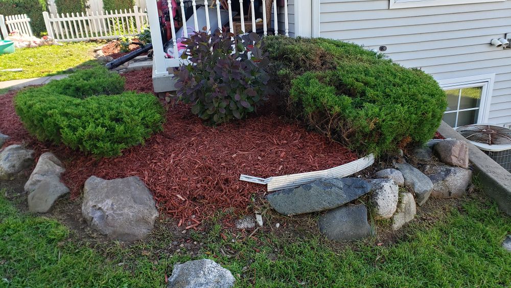 Enhance your garden's health and appearance with our professional mulch installation service, providing nutrient-rich soil cover that retains moisture, suppresses weeds, and adds a polished finish to your landscape. for Land Movers in Kalamazoo County, MI