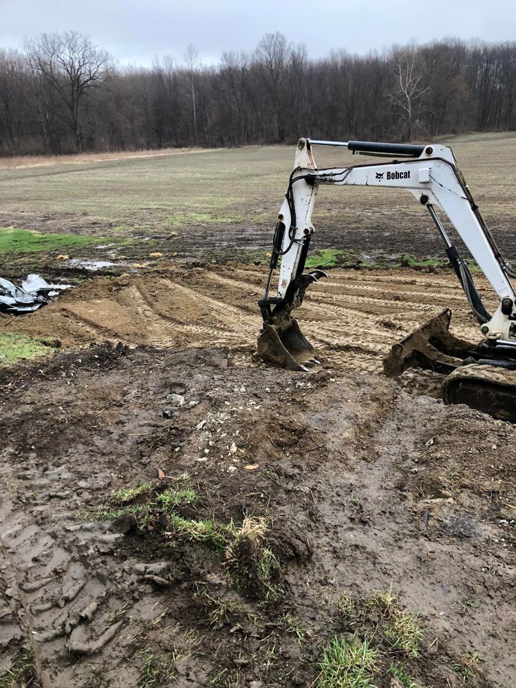 Our Debris Removal service ensures a clean and safe environment for your property by efficiently clearing away all unwanted waste and materials, leaving your space tidy and ready for the next project. for Mike Wilcoxson Excavating & Well Drilling in Pierceton,  IN