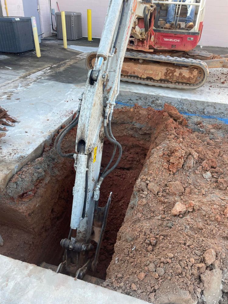 Our trenching service provides precise, efficient digging for utilities and drainage systems, ensuring minimal disruption to your property while delivering reliable solutions tailored to your specific needs and enhancing overall project success. for Heldapay Hauling & Grading in Charlotte, SC