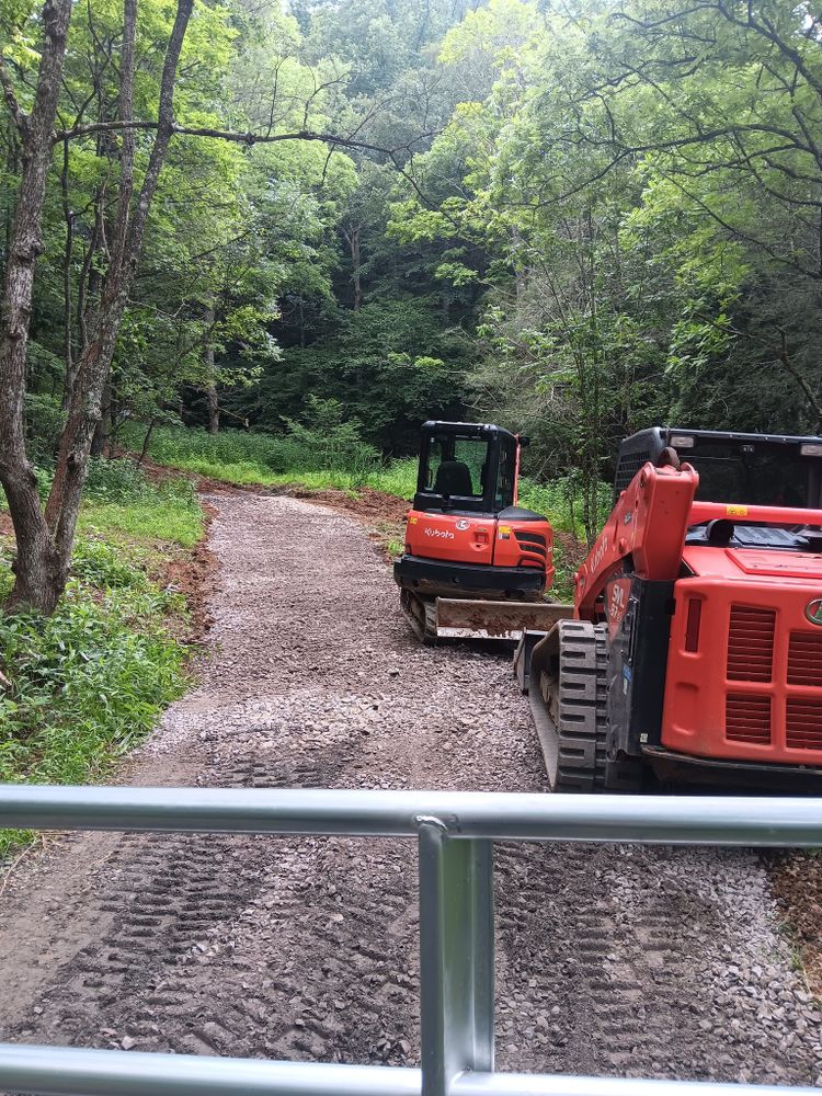 Our Roadbeds service expertly prepares a solid foundation for driveways and private roads, ensuring durability and quality by using advanced equipment and techniques tailored to your property's specific needs. for PCC Land Works in Marshall, NC