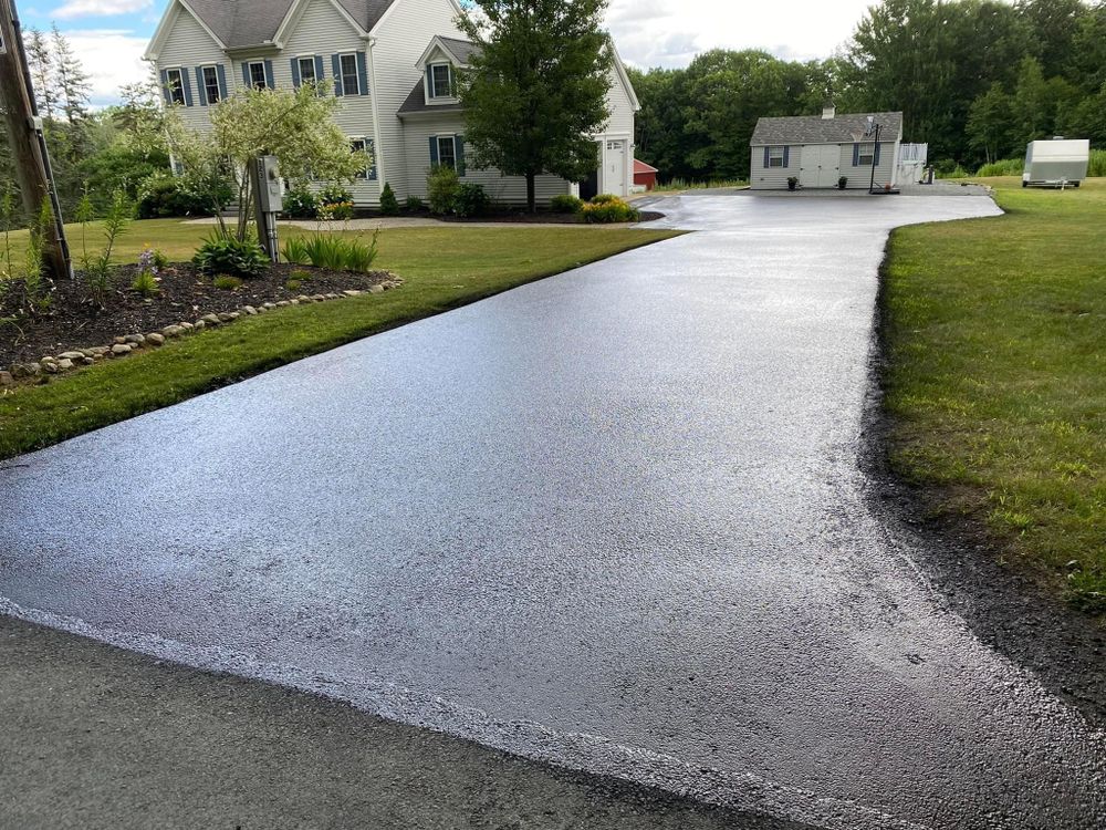 Enhance and extend your driveway's lifespan with our professional seal coating service, providing a protective barrier against weather damage, UV rays, and wear while maintaining an attractive, smooth surface for years. for Aldrich & Sons Asphalt Services in Lowell, MA