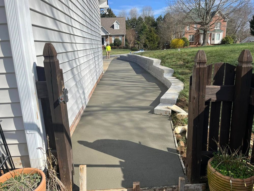 Our Concrete Slab Construction service provides durable, expertly crafted slabs perfect for driveways, patios, and foundations. We ensure precision and quality in every project to enhance your home's functionality and aesthetic appeal. for EC Concrete in Kernersville, NC