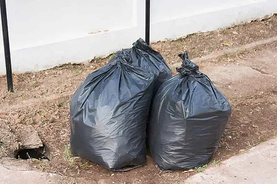 Doorstep trash pickup for THE TRASH HEROES in Coral Springs, FL