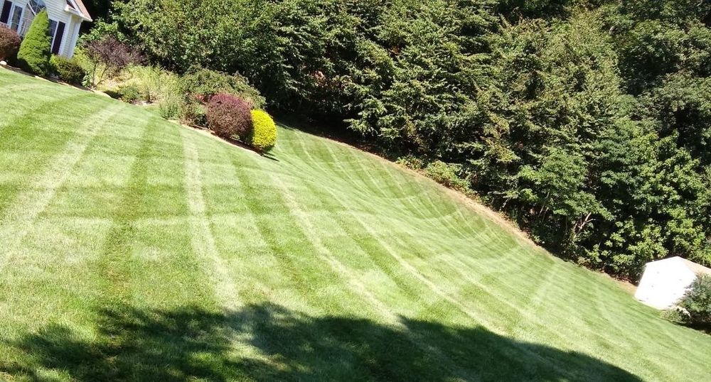 Our Lawn Care Management service ensures your yard is expertly maintained by knowledgeable professionals to enhance the health and appearance of your lawn, leaving you with a lush and beautiful outdoor space. for Grassy Turtle Services, LLC.  in Oxford, CT