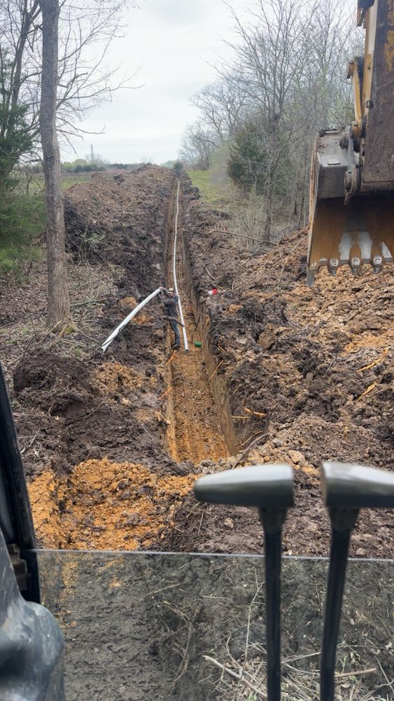Our Trenching and Drainage Systems service efficiently manages water flow, prevents flooding, and protects your home’s foundation by expertly designing and installing reliable drainage solutions tailored to your property’s unique needs. for Freedom Excavating in Ludlow, MO