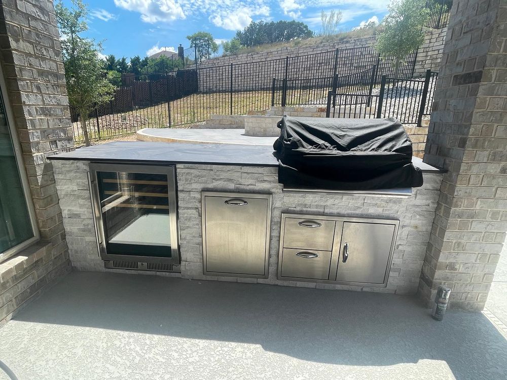 Transform your backyard into a paradise oasis with our Outdoor Kitchens service. Our experienced team will work with you to design and create a custom outdoor kitchen space perfect for entertaining. for Just Great Pools in Lakeway, TX