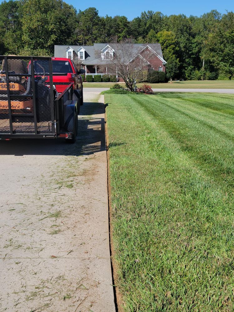 Our Edging service enhances the appearance of your lawn by creating clean, defined edges around flower beds and walkways, giving it a polished and well-maintained look. for Piedmont Lawn and Landscaping in Lexington, NC