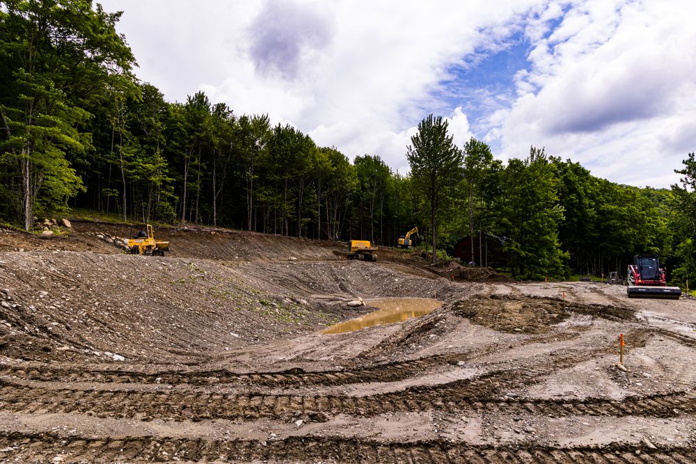 Carving a Pond into a Mountain Side for Andy Naylor Excavation in Johnson, VT