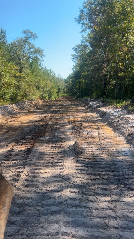 Our Roadbeds service ensures a stable, durable foundation for driveways or private roads through expert grading and compaction techniques, enhancing longevity and performance tailored to your property’s unique needs. for Barnhill land clearing LLC in Horry County, SC