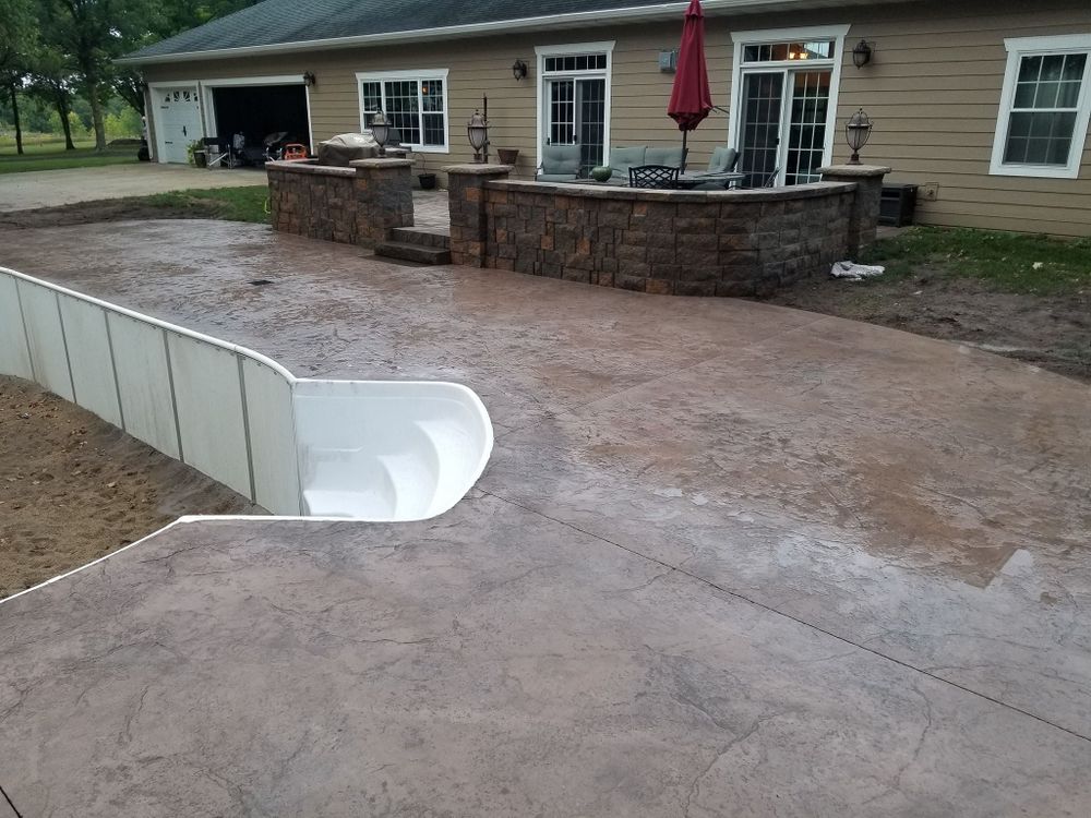 Enhance your outdoor space with our premium pool decking services. We offer durable, stylish concrete solutions for a safe, slip-resistant area, adding beauty and functionality to your poolside experience. for Majestic Concrete and Landscape in Cross Lake, MN