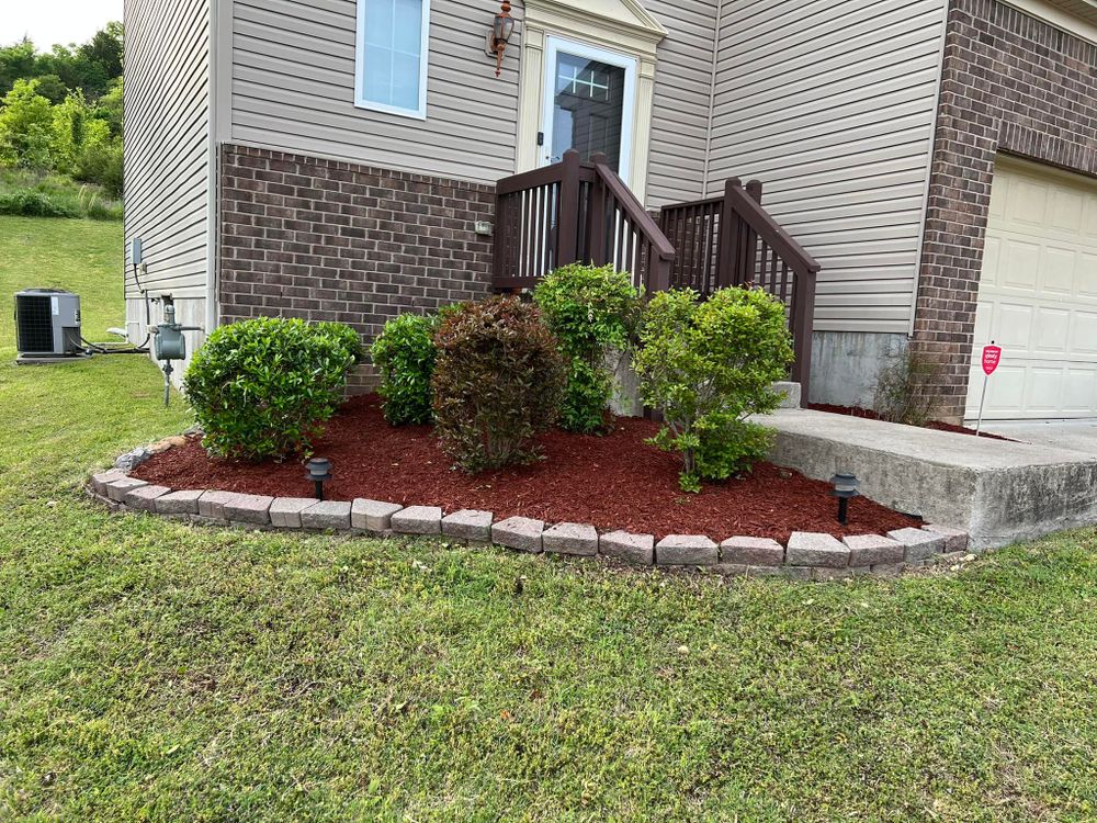 Enhance your garden's health and beauty with our Mulch Installation service, providing expertly applied mulch to retain moisture, suppress weeds, and enrich soil quality for a vibrant outdoor space. for Grass Management in Nashville, TN