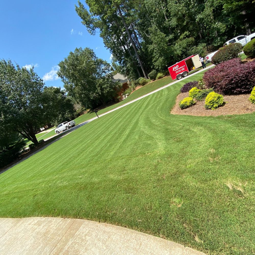 Our residential lawn care services provide expert maintenance and personalized attention to ensure your home's landscape remains lush, healthy, and beautiful throughout the seasons. Enjoy a vibrant outdoor space year-round. for JAD LANDSCAPE LLC in Conyers, GA