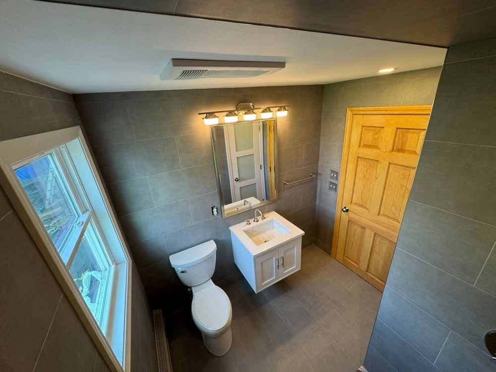 Transform your bathroom into a modern oasis with our expert renovation services. We blend functionality and style, using high-quality materials to create a space tailored to your personal taste and needs. for The Carpenter’s Touch in Pawtucket, RI