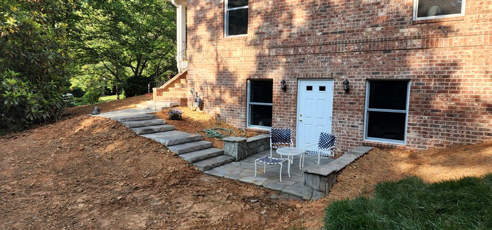 Transform your landscape with our expert flagstone stone work. Our skilled masonry team crafts durable, aesthetically pleasing stone walls that enhance your home's beauty and increase its value effortlessly. for Acosta's Stone Work in Henderson, NC