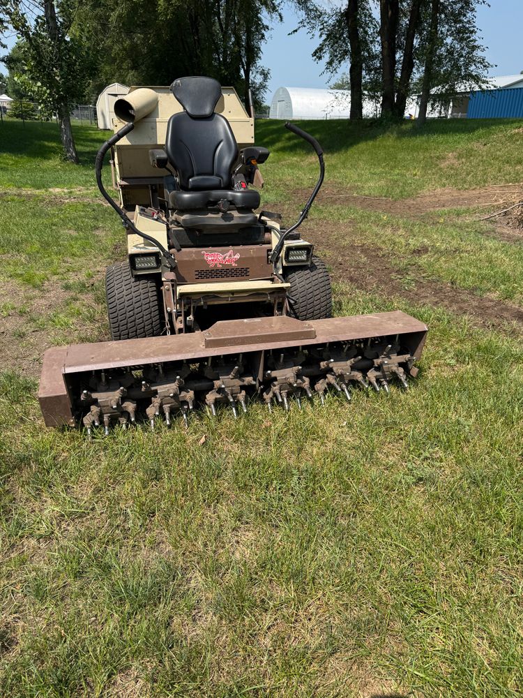 Our Lawn Aeration service enhances your lawn's health by improving soil airflow, promoting nutrient absorption, and strengthening root systems for a lush, vibrant yard that thrives throughout every season. for B&G Lawn Care in Roscoe, IL