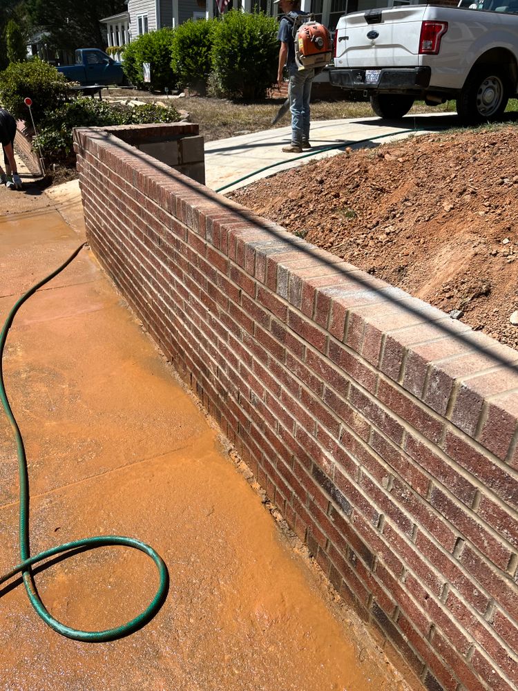 Our expert retaining wall construction service provides durable and aesthetically pleasing solutions, enhancing your landscape's functionality while preventing soil erosion and optimizing space usage with high-quality materials tailored to your home. for JR Tomberlin Masonry in Albemarle, NC
