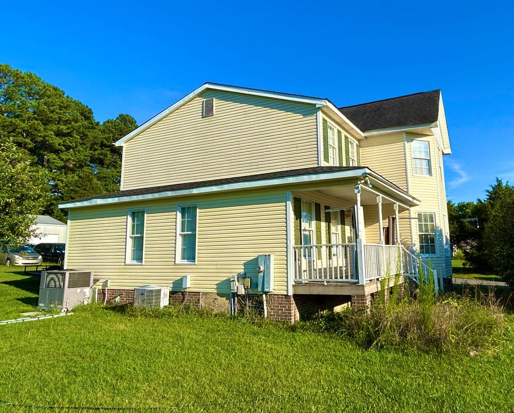 Enhance your home's curb appeal with our professional Pressure Washing service, removing dirt and grime from roofs, driveways, and siding. Trust us for a spotless finish that extends surface longevity. for Crown Roofing & Remodeling in Wake Forest, NC