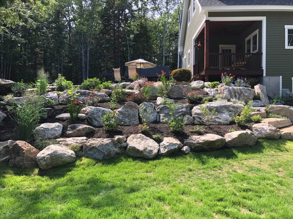 Enhance your landscape with our expert retaining wall construction service, providing durable and aesthetically pleasing solutions that effectively manage soil erosion while complementing your home's style. for Organic Innovations Stonework and Design in Brunswick, ME