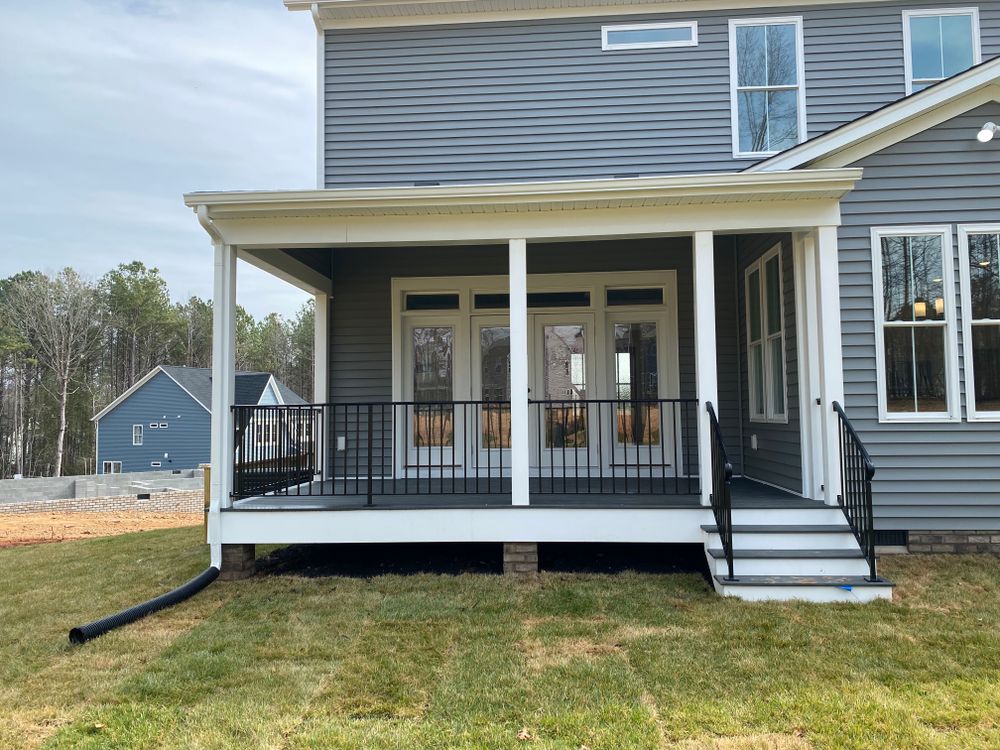 Transform your outdoor space with a Covered Porch, offering expert design and construction for a stylish, weather-protected area perfect for relaxation or entertaining in any season. for Lester Contracting LLC in Richmond, VA