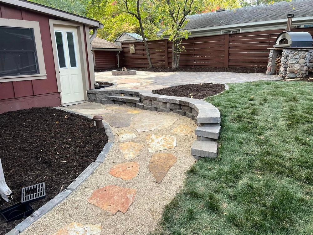 If you're looking to create an outdoor oasis, our patio design and construction service is perfect for you! We'll work with you to create a custom patio that perfectly fits your needs and style. for Boss Construction in Saint Paul, MN