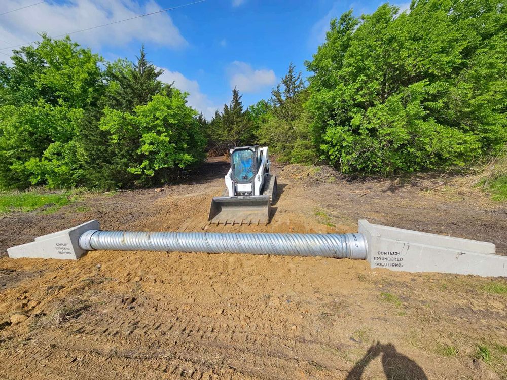 Our Culverts service provides homeowners with expert installation of underground pipes to manage water flow, prevent erosion, and protect the property's foundation from damage caused by flooding or runoff. for Sand And Gravel Solutions in Nevada, TX