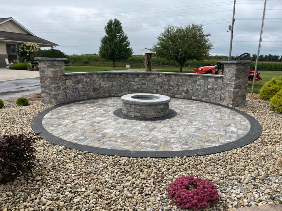 Our Hardscaping service enhances the function and aesthetics of your outdoor space with features like patios, walkways, retaining walls, and driveways to create a beautiful and functional landscape for you. for T.N.T Lawn Care, LLC in Wolcottville, IN