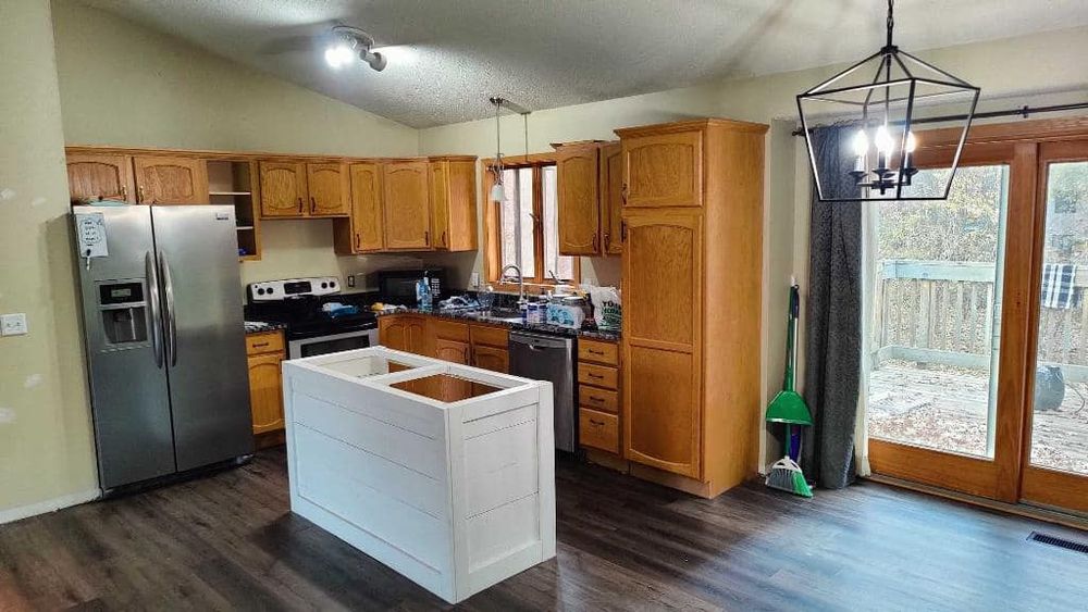 Transform your outdated kitchen and cabinets with our professional refinishing service. We offer skilled craftsmanship, high-quality materials, and a wide range of color options to bring new life to your space. for Vivid Color Painting in Baxter, MN