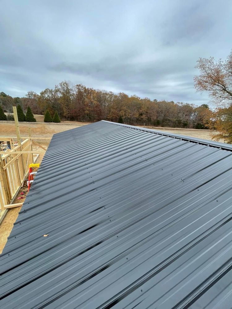 Enhance your home with our durable and stylish metal roofing services, offering exceptional weather resistance, energy efficiency, and long-lasting protection to ensure peace of mind for years to come. for Teague Construction in Ramer, TN