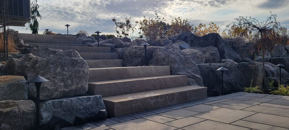 Transform your outdoor space with our natural stone hardscape service, offering durable and aesthetically pleasing solutions that enhance your home's beauty while providing functionality and timeless elegance. for Admiring Landscapes in Lancaster, OH