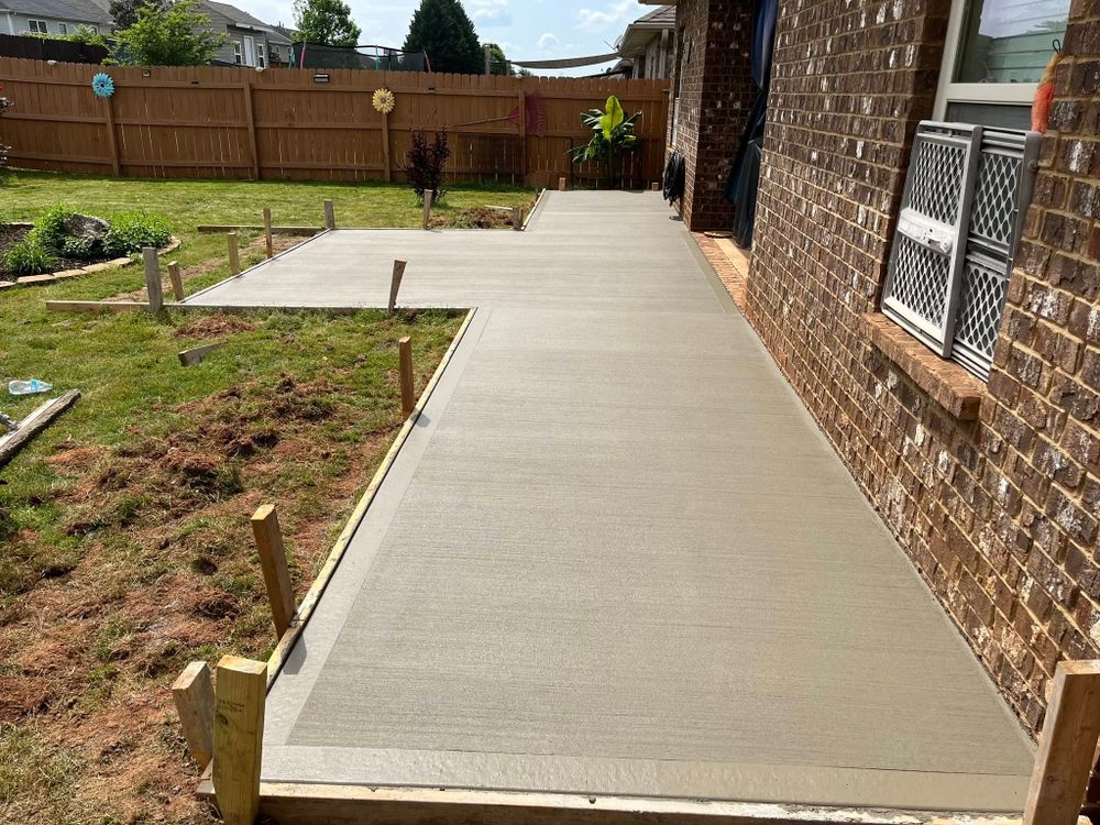 Enhance your home's curb appeal with our professional sidewalk installation services, offering durable and aesthetically pleasing concrete pathways designed to complement your property while ensuring safe, reliable access for all. for Wicks Construction Group in Duncan, SC