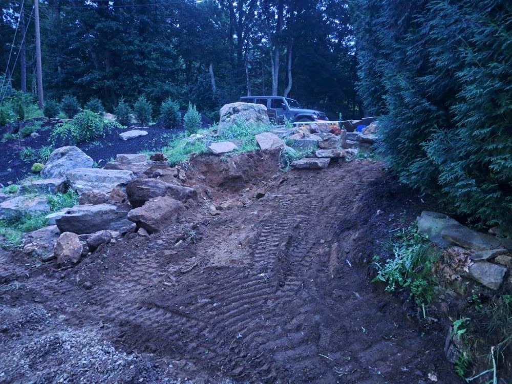 Our Leveling service expertly transforms uneven terrain into a smooth, stable foundation, ensuring your construction project begins on the right track with precision grading for optimal stability and drainage. for Divine Dirt Work in Worcester, MA