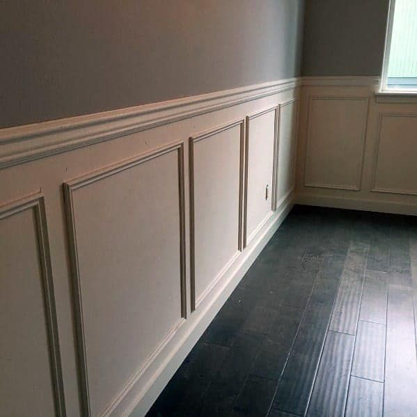 Our Trim Walls service offers homeowners the opportunity to add sophistication and elegance to their living spaces by professionally installing decorative trim such as crown molding, baseboards, and wainscoting to full accent walls. for Top Quality Contracting, LLC in Jacksonville, FL