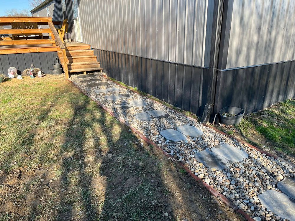 Our Hardscape Installation service creates beautiful, durable patios, walkways, retaining walls, and outdoor living features that enhance your property’s function, curb appeal, and long-term value with expert craftsmanship. for Garcia Lawn Service & Landscaping in Lafayette, TN