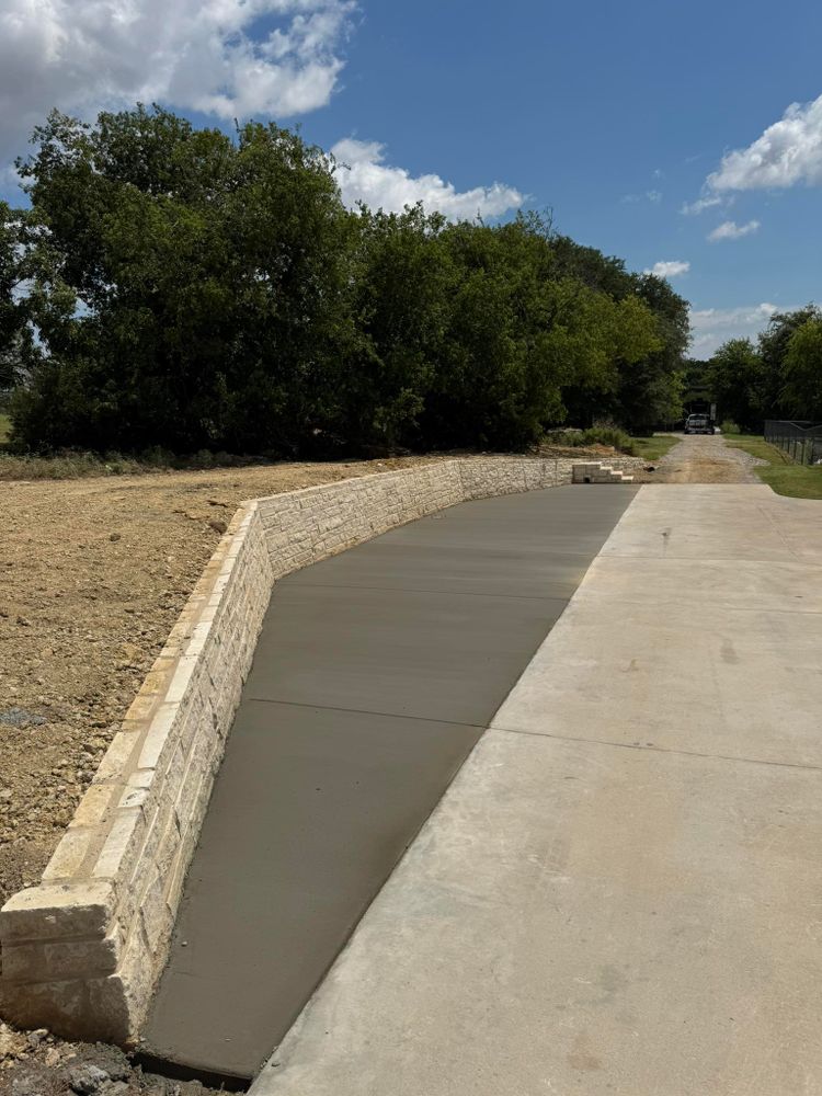 Our retaining wall construction service enhances your landscape's functionality and aesthetics, providing durable solutions to manage soil erosion, create level spaces, and complement your home's exterior with expertly crafted concrete structures. for G2 Custom Concrete in Dallas, TX