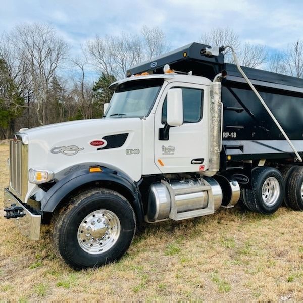 Our hauling service efficiently removes all debris, trees, brush piles, or construction materials from your property after land clearing projects, ensuring a clean and organized result for your home. for Shearon Trucking and Excavating LLC in Nashville,  TN