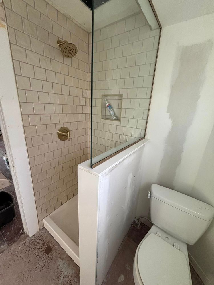Transform your bathroom into a modern oasis with our expert renovation services. We deliver high-quality craftsmanship, tailored designs, and efficient project management for a stress-free and elegant upgrade to your home. for Roache Construction in Erie, PA