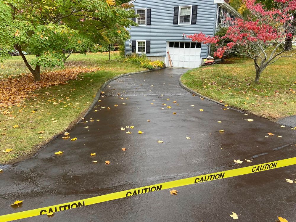 Our Seal Coating service provides a protective layer for your asphalt, enhancing durability and appearance while preventing damage from water, oil, and UV rays. Extend your driveway's lifespan with our expert solutions today. for Side Hustle Home Services  in Upton, MA