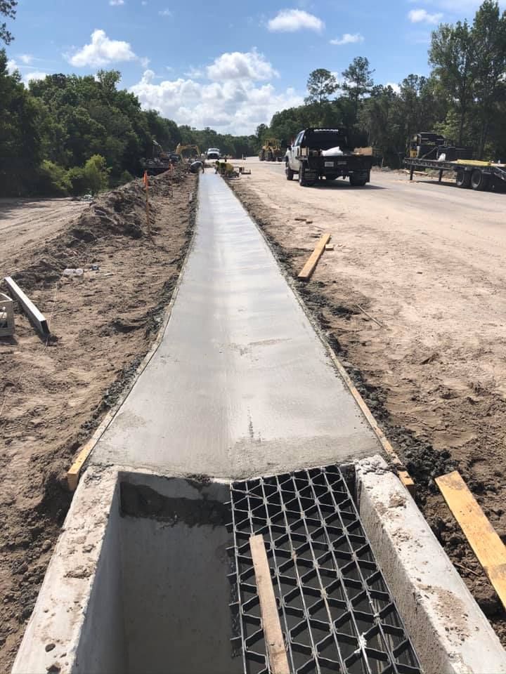 Our DOT Curbs service offers precise, durable curb installations that enhance property aesthetics and ensure compliance with Department of Transportation standards, providing homeowners with safe and appealing driveway edge solutions. for Lamar Construction in North Central, FL