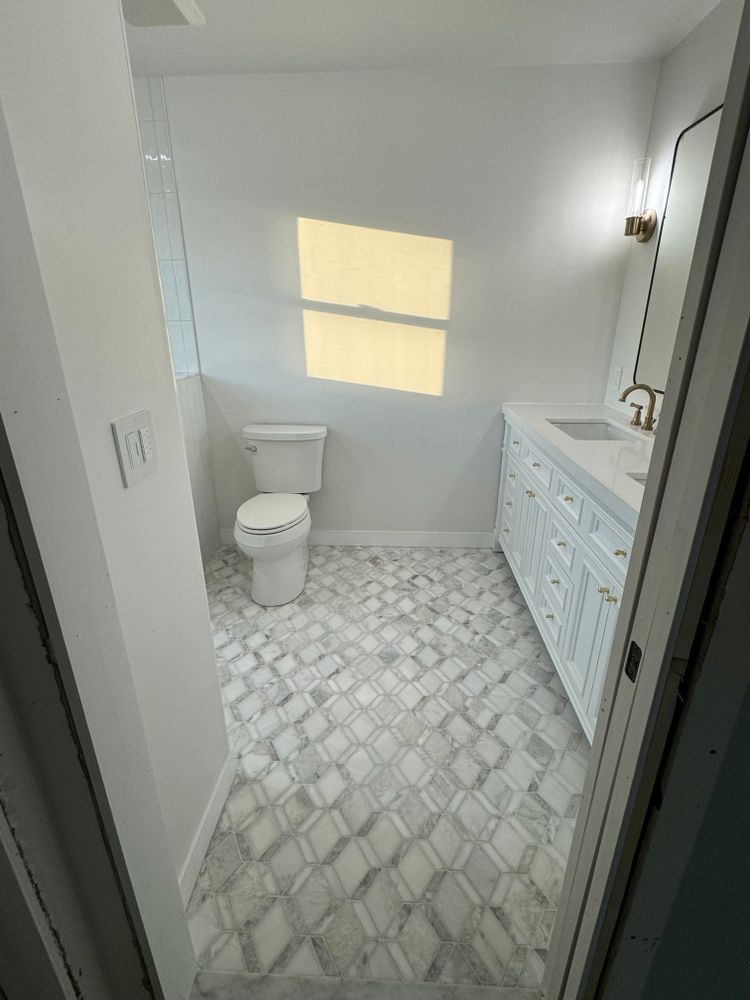 Tile showers and tub surrounds for Chapman Surfaces Tile & Remodeling in Milan, MI