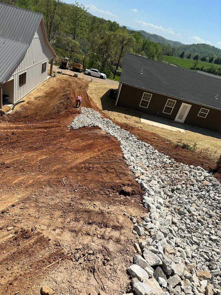 Our drainage service helps prevent water damage to your property by efficiently removing excess water and directing it away from your home, keeping your land clear and free of standing water. for Wilson Quality Construction  in New Tazewell, TN