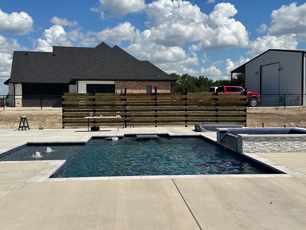 Transform your backyard with our expert custom home construction services. We design tailored pools that perfectly complement your landscape, enhancing beauty and functionality for ultimate relaxation and entertainment. for Black Diamond Custom Pools LLC in Azle, TX