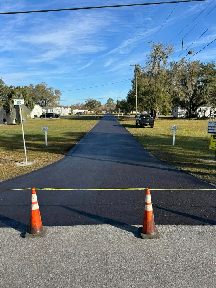 Enhance your driveway's durability and appearance with our Seal Coating service. We protect against weather damage, prevent cracks, and extend the lifespan of your asphalt for a smooth, long-lasting finish. for Pavesheild in Haines City, FL