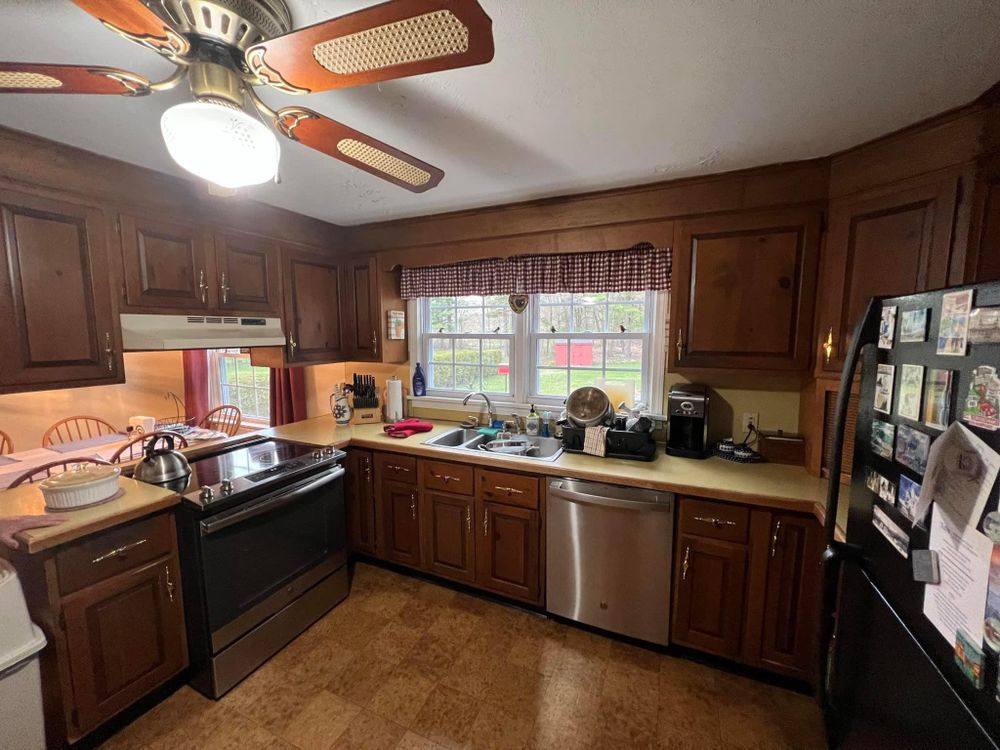 Enhance the beauty of your home with our Kitchen and Cabinet Refinishing service. Transform outdated cabinets into modern masterpieces, elevating the aesthetics of your kitchen effortlessly. for Suter & Sons Painting in Amherst, Western Massachusetts