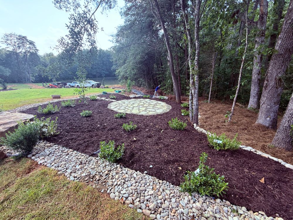 Enhance your garden's health with our efficient mulch delivery service. We offer a variety of high-quality mulches, expertly installed to retain moisture, suppress weeds, and boost curb appeal effortlessly. for Rainman Pro Irrigation and Landscape LLC in Lyman, SC