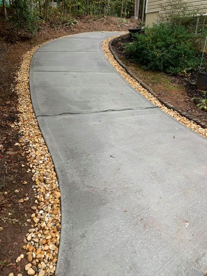 Our Sidewalk Installation service offers homeowners a professional and reliable solution to enhance the appearance of their property while providing a safe walking path for family and guests. for Compadres Concrete in Griffin, GA