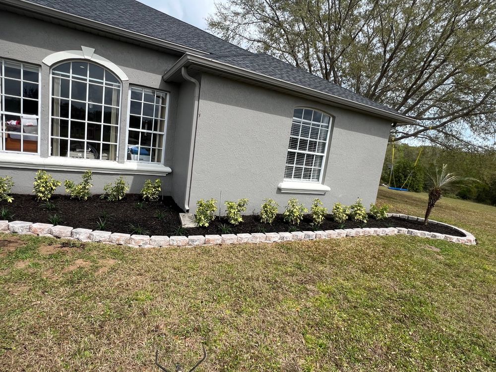 Landscape with retaining wall for Thurmond & Sons Landscaping  in Montverde, FL