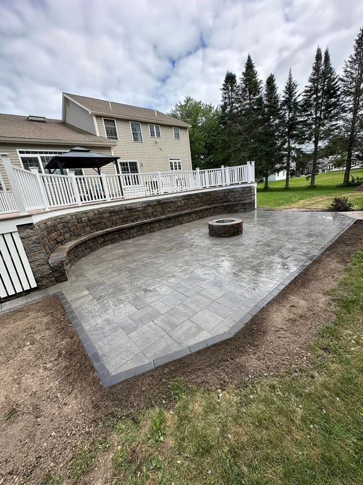 Enhance your outdoor living space with our expert patio design and installation services, crafted to blend beauty and functionality, providing a perfect setting for relaxation or entertaining in any season. for Pine Stream Property Management in Waterboro, ME
